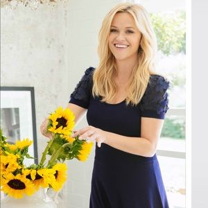 Draper James Blue knit dress with floral sleeve.